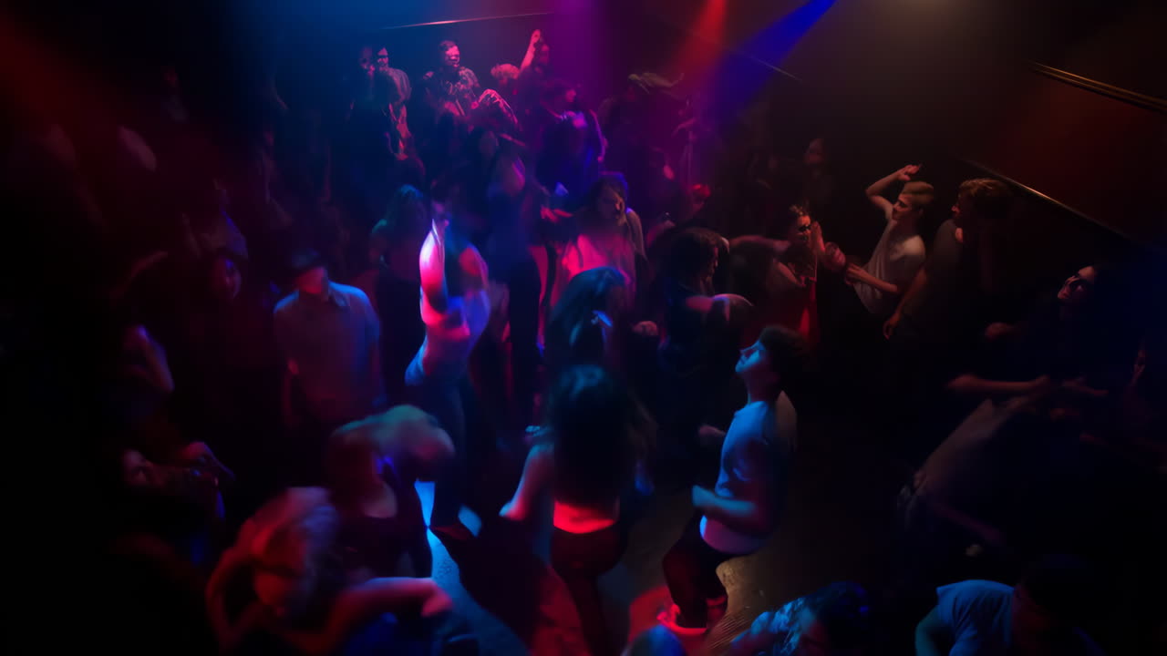 Nightclub scene with people dancing and enjoying the music