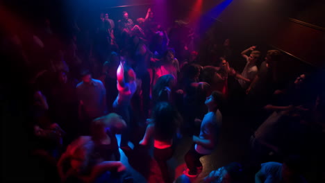 nightclub scene with people dancing and enjoying the music