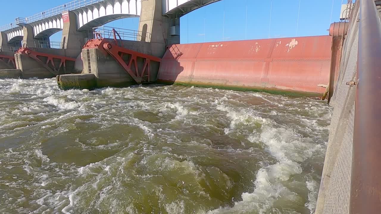 Dam 14 and turbulent downstream water of the Mississippi River, Hampton Illinois