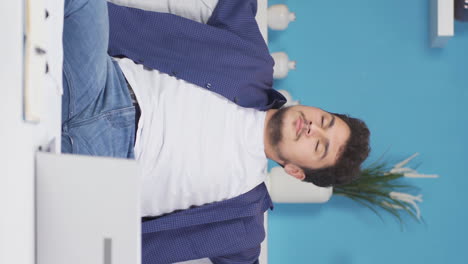 Vertical-video-of-Happy-deep-breathing-man.