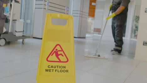 camera focuses wet floor warning sign 1