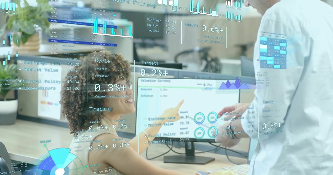 Financial analyst reviewing data when colleague arriving and analyzing chart overlays together