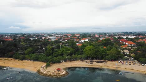 beautiful cinematic sanur beach, bali drone footage with interesting landscape, fishing boats and calm weather