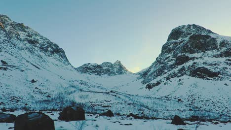 Mountain-covered-in-snow-in-winter-filmed-from-a-moving-car