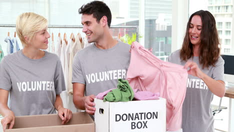 volunteers friends holding donation boxes