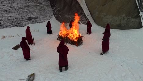 winter ritual by people in red robes