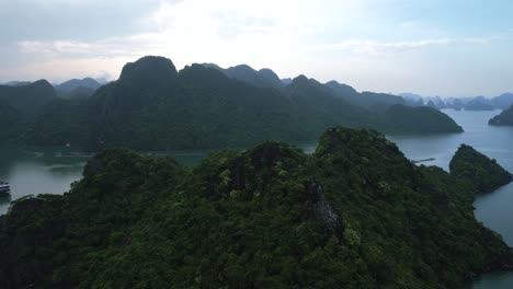 aerial-of-beautiful-green-limestone-cliffs-in-Ha-Long-Bay-Vietnam-at-sunset