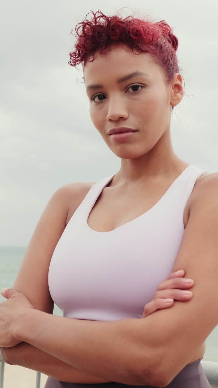 Fitness Woman at Beach with Arms Crossed