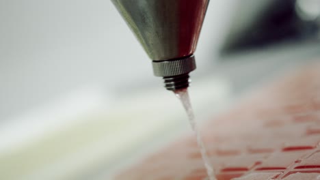 Pouring-clear-candy-liquid-into-plastic-tray