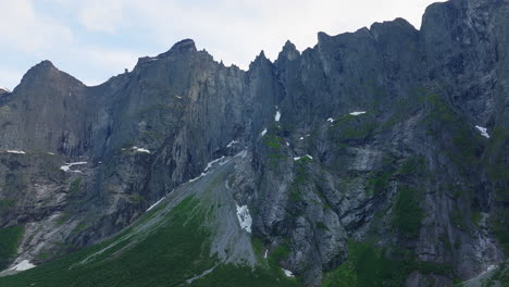 Aerial-view-of-dramatic-and-rugged-Troll-Wall-towering-mountains,-Rauma,-Norway