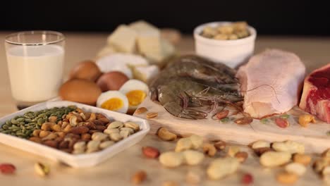 variety of protein-rich foods on black background