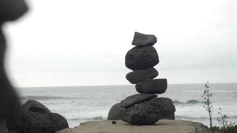 pile of stacked stones near the ocean