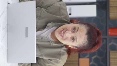 Vertical-video-of-Cheerful-and-caring-business-woman-looking-at-camera.