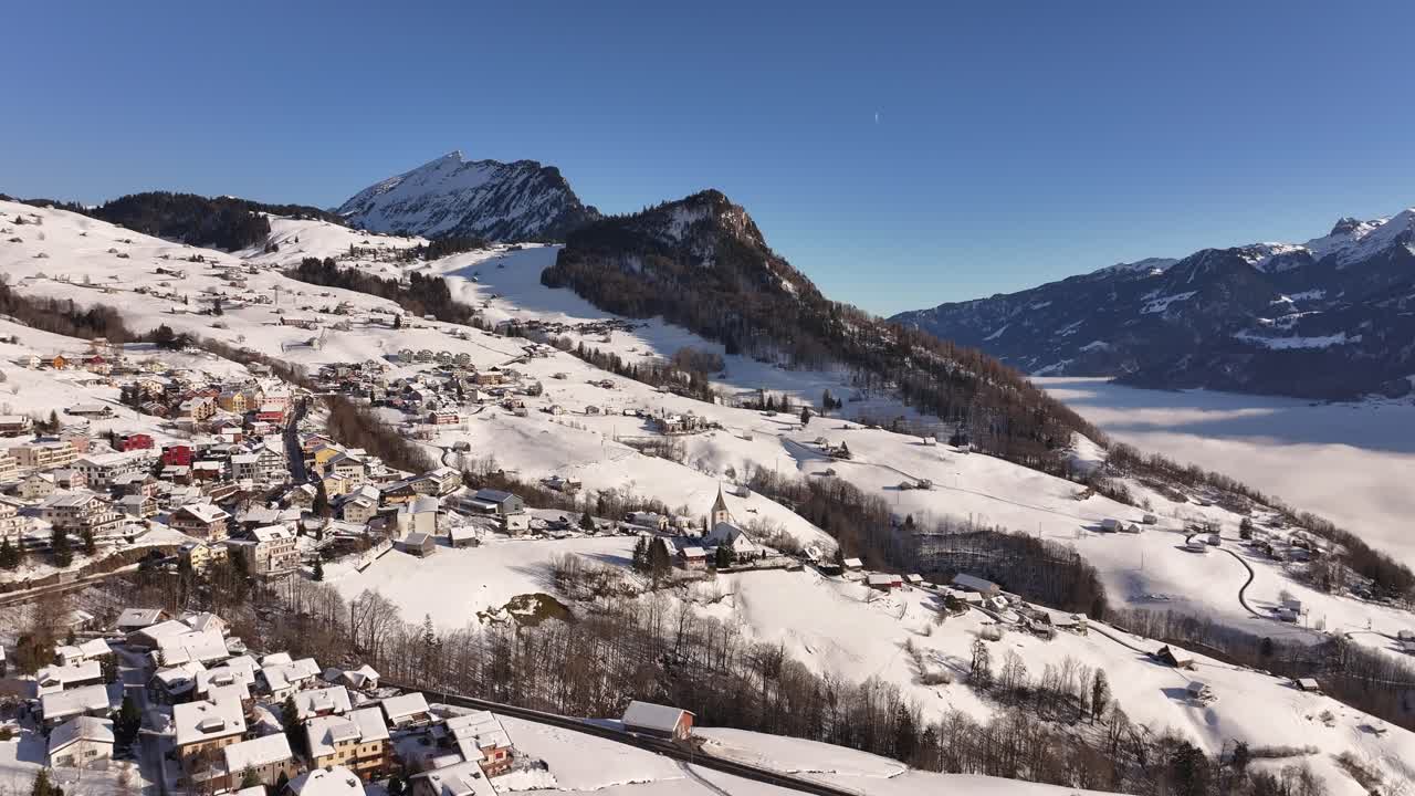Snowy landscape of Amden, Arvenbüel, and Weesen with mountains and lake in Switzerland