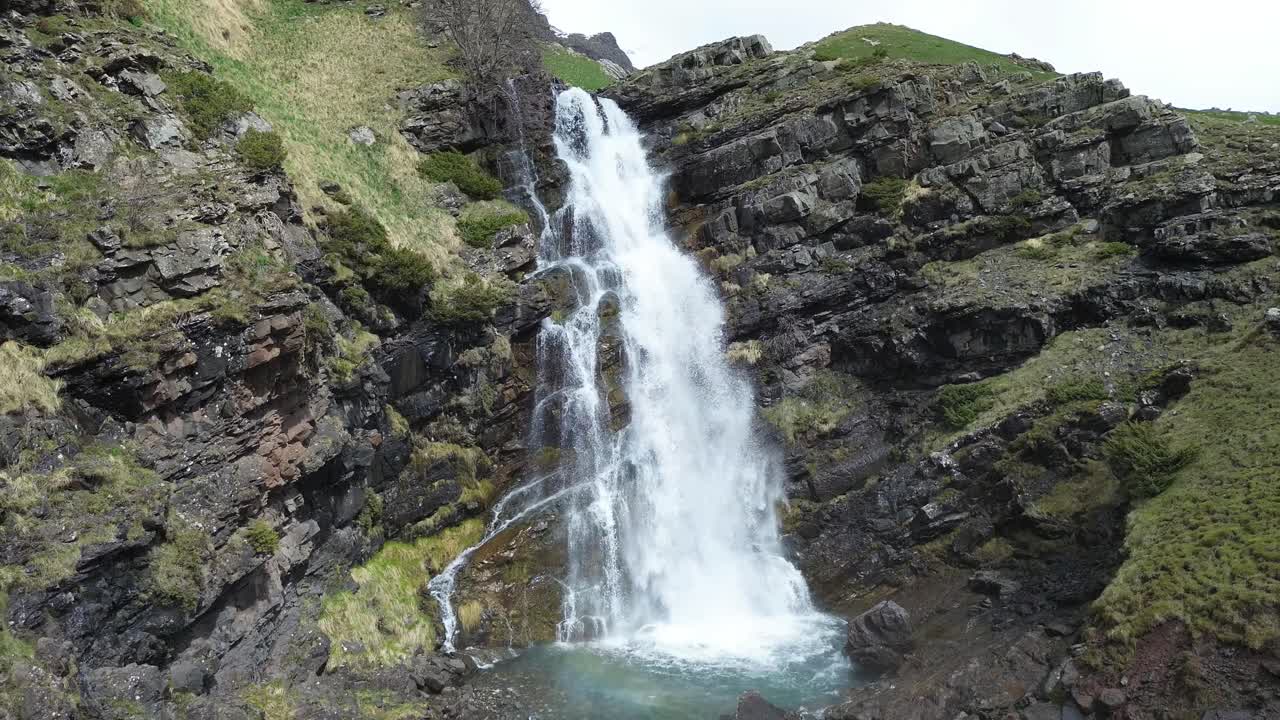 Waterfall cascading over rocky cliffs in Valle de Izas, Aragón, Spain, shot in 60FPS