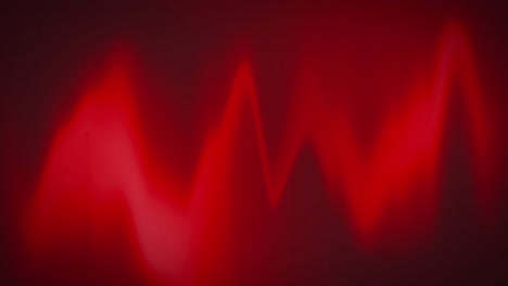 animación digital de las ondas rojas del monitor de frecuencia cardíaca sobre un fondo negro