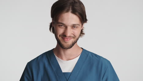 Caucasian-man-in-front-of-camera-on-white-background.