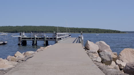 first person view walking onto a dock at the lake