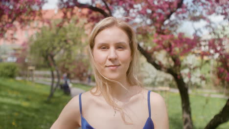 blonde woman smiling at camera