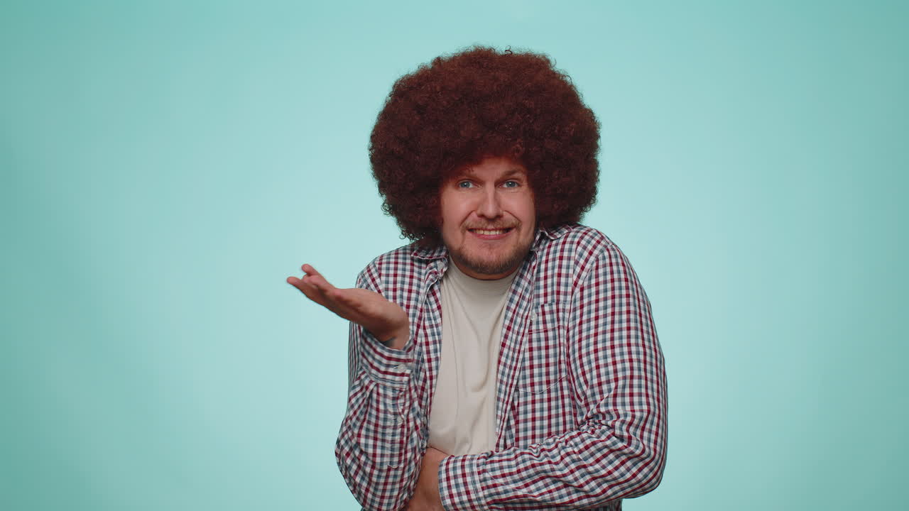 Confused man feeling embarrassed about ambiguous question, having doubts, no idea clueless uncertain