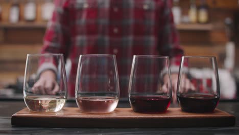 a flight of fine wine is pushed forward in this beautiful, 4k clip