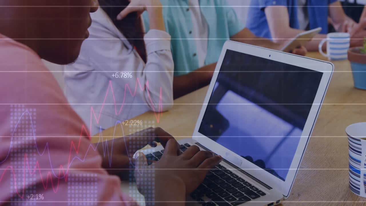 Statistical data processing against african american man using a laptop at office