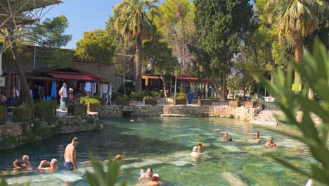people relaxing in a natural hot spring