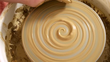 creating beautiful pottery: the art of throwing clay on a pottery wheel demonstrated through two key frames capturing the transformation of a clay form