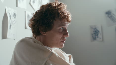 psychiatric patient in straitjacket emotionally speaking to doctor in hospital