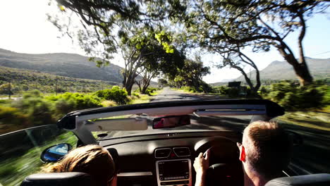 Couple-driving-convertible-car-cabriolet-cape-town-south-africa-steadicam-shot