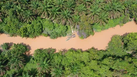 picture techniques using drone zoom a boat by the rivers in jambi province, indonesia