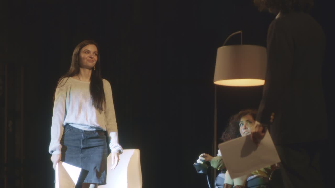 Woman Presenting to Person in Wheelchair