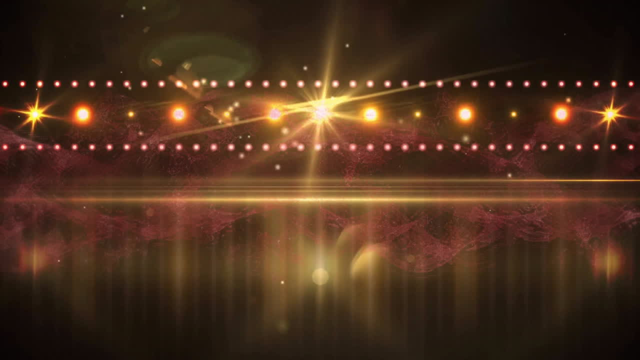 Animation of light spots and trails on black background