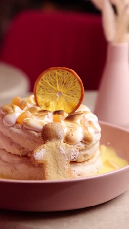 layered dessert with meringue and orange