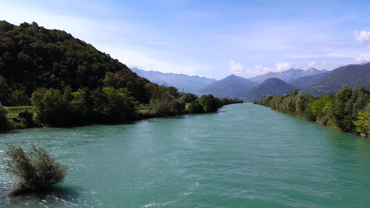 Fly out over Adda river in Lombardy region, Italy