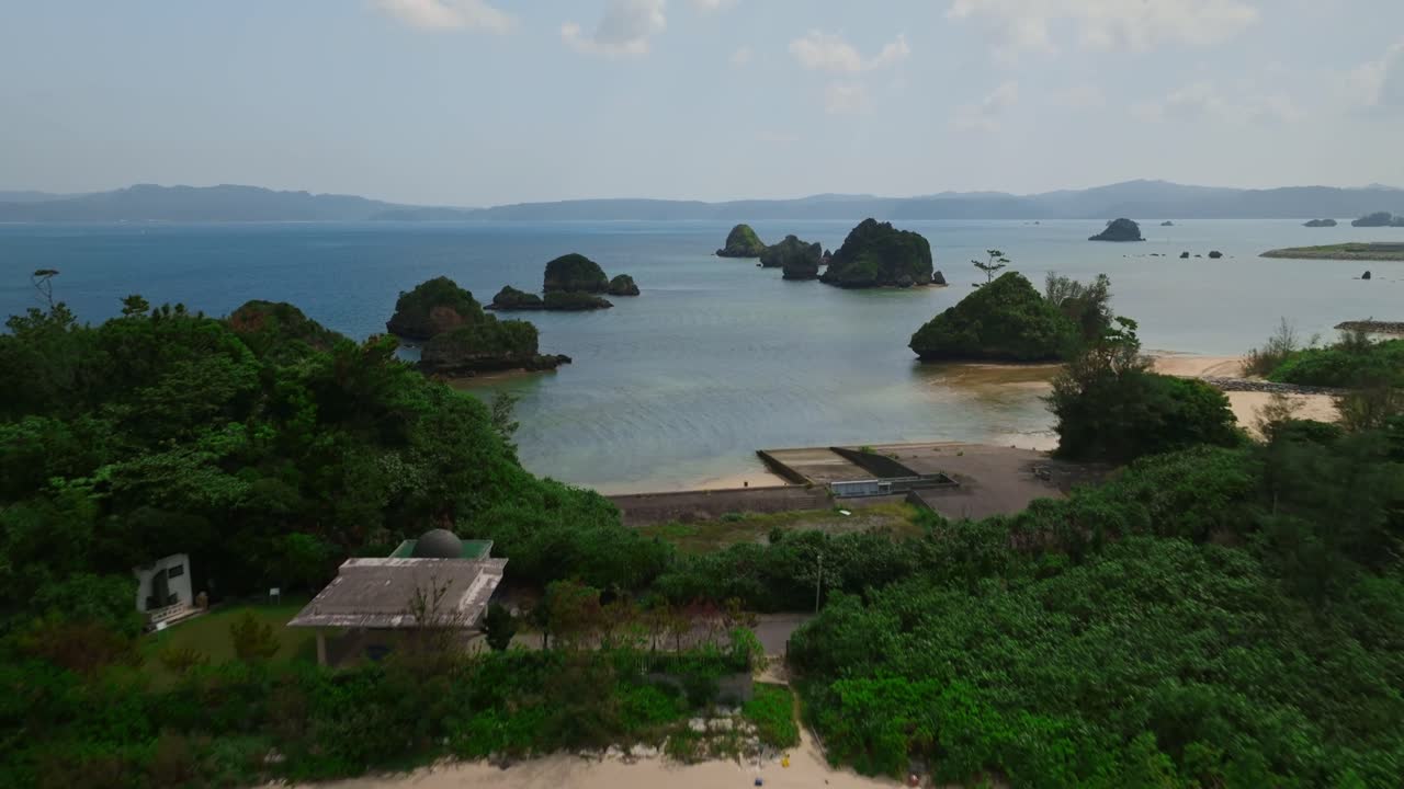 Tilt up reveal shop of coastline in Okinawa, Japan
