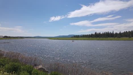 People-kayaking-on-the-Henry's-Fork-in-Island-Park,-Idaho