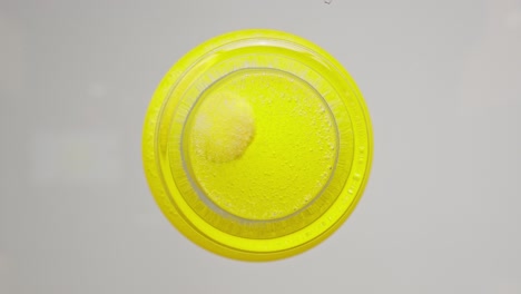 effervescent vitamin tablet dissolving in water, bubbling with refreshing fizz
