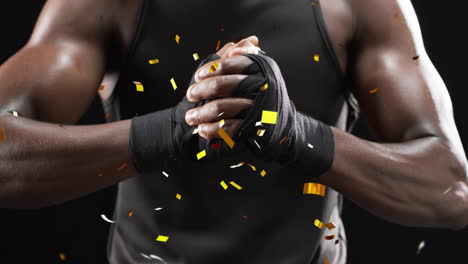 animation of confetti falling over african american male boxer on black background