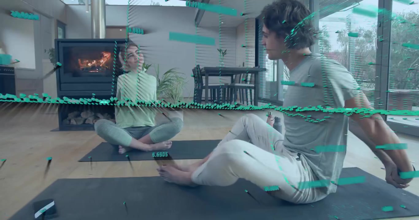 Duas mulheres praticando yoga torcendo as colunas na inspiração, sincronizando dados girando ao redor do corpo para insights de saúde
