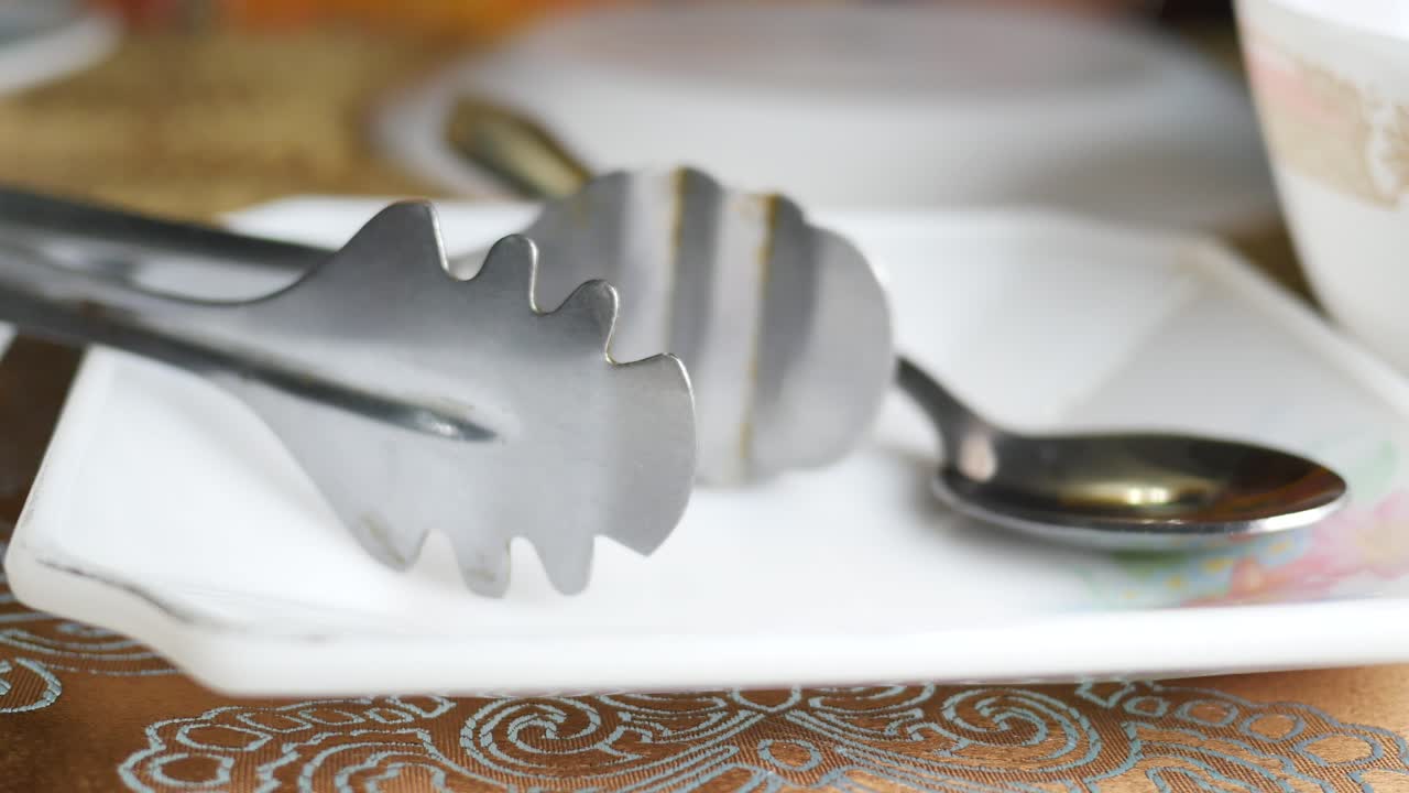 Table Setting with Tongs and Spoon