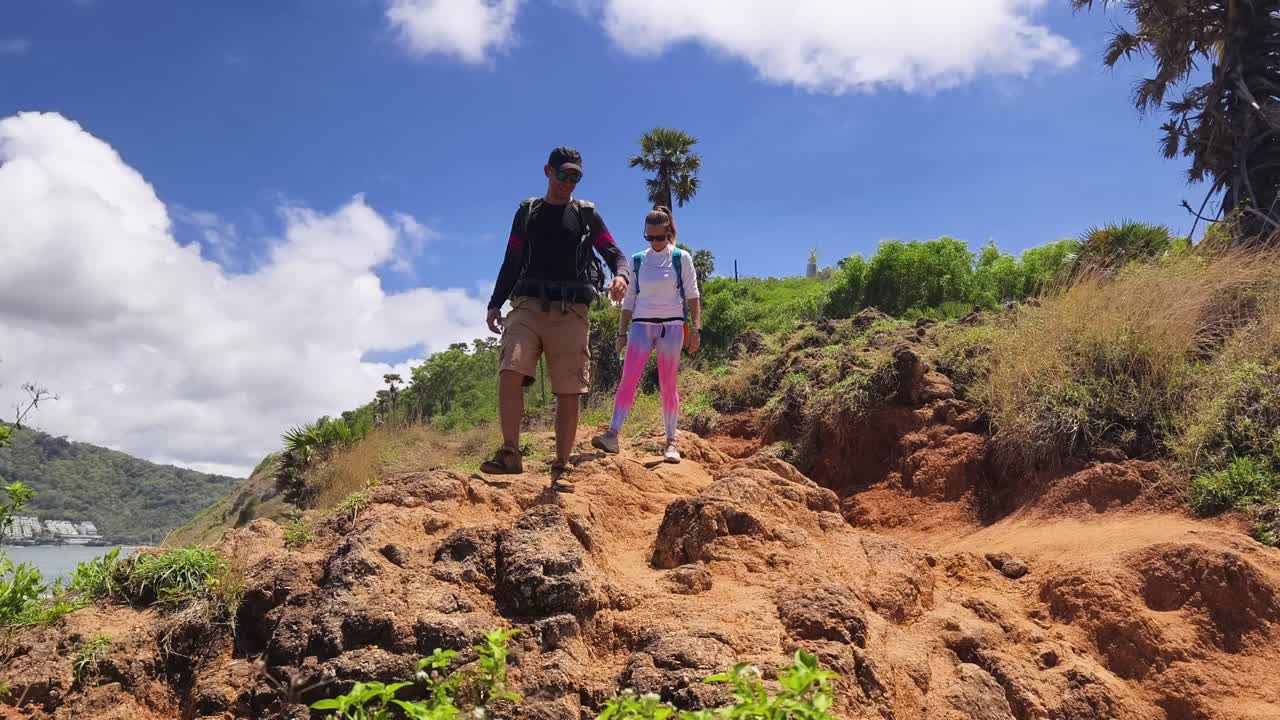 Couple Hiking Through Scenic Trail