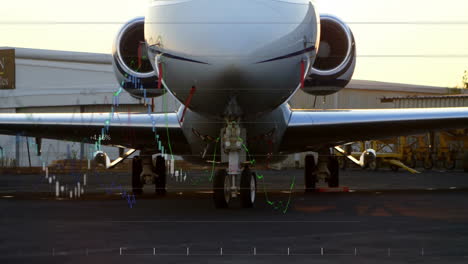 private jet parked on tarmac with financial data processing animation overlay