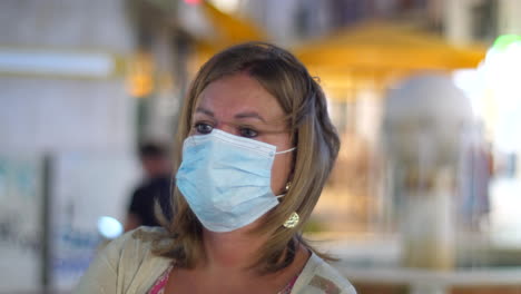 close up of blonde woman with facial mask