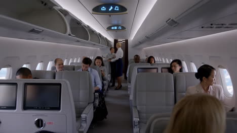 passengers and flight attendants aboard a commercial airplane cabin