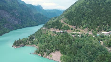 Aerial-view-from-drone-of-a-river-amongst-mountains-and-the-beautiful-nature-in-Georgia