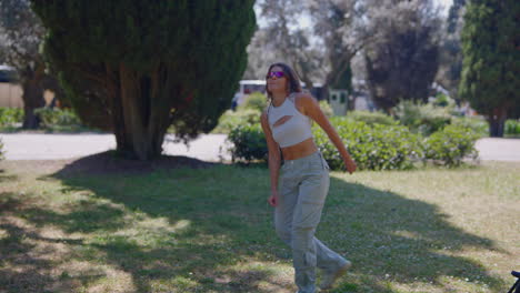 woman dancing in a park