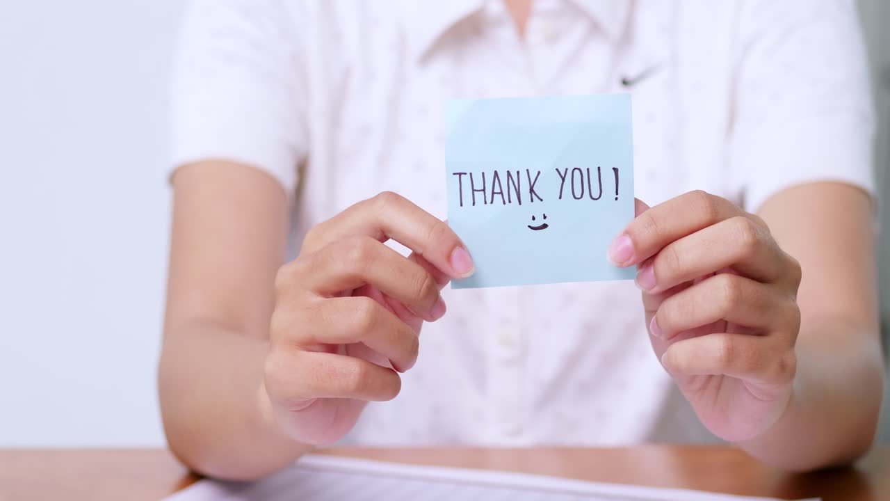 A heartfelt thank you expressed through a simple note showcasing appreciation a personal moment