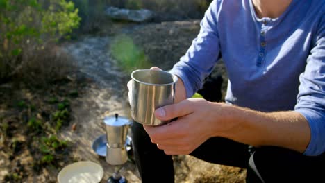 male hiker having coffee in countryside 4k