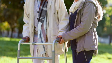 Senior-woman,-hands-and-walker-with-nurse-outdoor